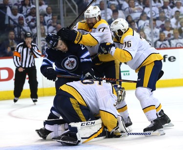 Winnipeg Jets centre Paul Stastny (left) gets the rough treatment from Nashville Predators forward Scott Hartnell and defenceman P.K. Subban which pursuing a rebound near goaltender Pekka Rinne during Game 4 of their second-round NHL playoff series in Winnipeg on Thurs., May 3, 2018. Kevin King/Winnipeg Sun/Postmedia Network