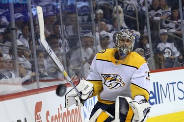 Nashville Predators goaltender Pekka Rinne rims the puck around the glass during Game 4 of their second-round NHL playoff series against the Winnipeg Jets in Winnipeg on Thurs., May 3, 2018. Kevin King/Winnipeg Sun/Postmedia Network