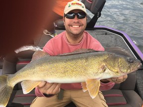 Justin Stapon with a fine Falcon Lake walleye.