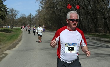 Participants run through Assiniboine Park during the Winnipeg Police Service half marathon in Winnipeg on Sun., May 6, 2018. Kevin King/Winnipeg Sun/Postmedia Network