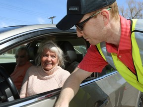 Chesia Senicki and husband Bela Lorinc are assisted as CAA Manitoba held a CarFit event at its St. Anne's Road location on Sunday, working with the Canadian Association of Occupational Therapists to help maturing drivers stay safe and comfortable in their vehicles.