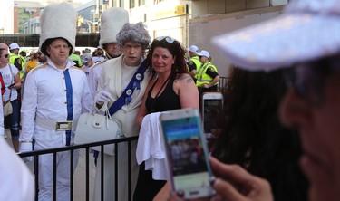 The Queen has her picture taken with some of her subjects at the Whiteout Street Party prior to the Winnipeg Jets facing the Nashville Predators in Game 6 of their NHL playoff series in Winnipeg on Mon., May 7, 2018. Kevin King/Winnipeg Sun/Postmedia Network