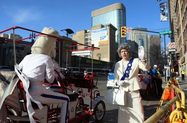 The Queen stands on Donald Street at Portage Avenue after arriving for the Whiteout Street Party prior to the Winnipeg Jets facing the Nashville Predators in Game 6 of their NHL playoff series in Winnipeg on Mon., May 7, 2018. Kevin King/Winnipeg Sun/Postmedia Network