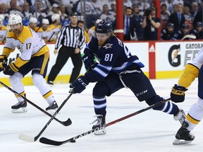 Winnipeg Jets forward Kyle Connor (centre) tries to split Nashville Predators defencemen Mattias Ekholm (left) and P.K. Subban during Game 6 of their NHL playoff series in Winnipeg on Mon., May 7, 2018. Kevin King/Winnipeg Sun/Postmedia Network