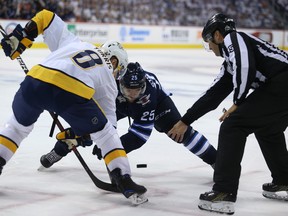 Winnipeg Jets centre Paul Stastny (right) and Nashville Predators centre Kyle Turris face-off during Game 6.