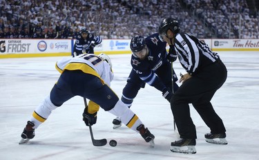 Winnipeg Jets centre Mark Scheifele (right) and Nashville Predators centre Colton Scissons face-off during Game 6 of their NHL playoff series in Winnipeg on Mon., May 7, 2018. Kevin King/Winnipeg Sun/Postmedia Network