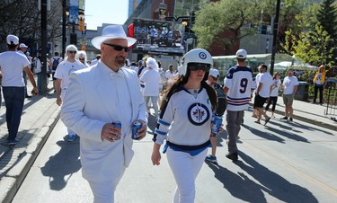 Fans walk the streets at the Whiteout Street Party prior to the Winnipeg Jets facing the Vegas Golden Knights in Game 1 of their Western Conference final series in Winnipeg on Sat., May 12, 2018. Kevin King/Winnipeg Sun/Postmedia Network