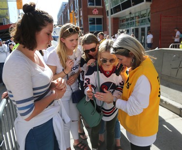 Fans wait to have their ticket checked entering the Whiteout Street Party prior to the Winnipeg Jets facing the Vegas Golden Knights in Game 1 of their Western Conference final series in Winnipeg on Sat., May 12, 2018. Kevin King/Winnipeg Sun/Postmedia Network