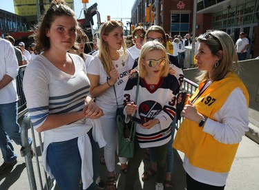 Fans wait to have their ticket checked entering the Whiteout Street Party prior to the Winnipeg Jets facing the Vegas Golden Knights in Game 1 of their Western Conference final series in Winnipeg on Sat., May 12, 2018. Kevin King/Winnipeg Sun/Postmedia Network