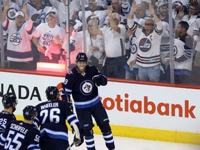 Winnipeg Jets forward Patrik Laine is congratulated on his goal against the Vegas Golden Knights during Game 1 on Saturday.