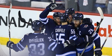 The Winnipeg Jets celebrate a goal from Patrik Laine against the Vegas Golden Knights during Game 1 of their Western Conference final series in Winnipeg on Sat., May 12, 2018. Kevin King/Winnipeg Sun/Postmedia Network