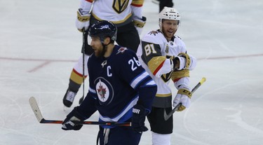 Vegas Golden Knights centre Jonathan Marchessault (right) celebrate a goal from defenceman Brayden McNabb as Winnipeg Jets forward Blake Wheeler skates by during Game 1 of their Western Conference final series in Winnipeg on Sat., May 12, 2018. Kevin King/Winnipeg Sun/Postmedia Network