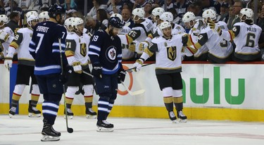 Vegas Golden Knights centre Jonathan Marchessault celebrates a goal from William Karlsson at the bench as Bryan Little (centre) and Ben Chiarot of the Winnipeg Jets during Game 1 of their Western Conference final series in Winnipeg on Sat., May 12, 2018. Kevin King/Winnipeg Sun/Postmedia Network