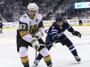 Winnipeg Jets forward Andrew Copp (right) gets after Vegas Golden Knights forward David Perron during Game 1 of their Western Conference final series in Winnipeg last May.