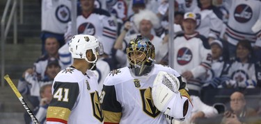 Vegas Golden Knights goaltender Marc-Andre Fleury (right) smiles with forward Pierre Edouard Bellemare as he's heckled by fans during Game 1 of their Western Conference final series against the Winnipeg Jets in Winnipeg on Sat., May 12, 2018. Kevin King/Winnipeg Sun/Postmedia Network