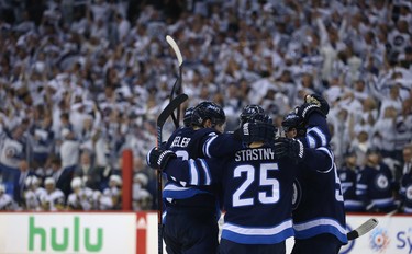 The Winnipeg Jets celebrate a goal from Mark Scheifele against the Vegas Golden Knights during Game 1 of their Western Conference final series in Winnipeg on Sat., May 12, 2018. Kevin King/Winnipeg Sun/Postmedia Network