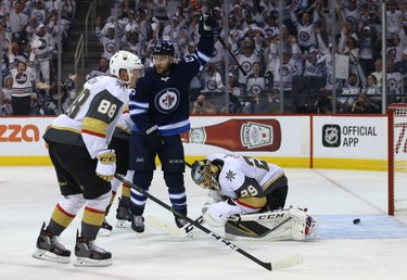 Winnipeg Jets centre Paul Stastny raises his stick to celebrate a power-play goal from Mark Scheifele against the Vegas Golden Knights during Game 1 of their Western Conference final series in Winnipeg on Sat., May 12, 2018. Kevin King/Winnipeg Sun/Postmedia Network