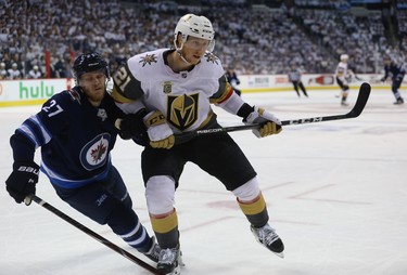 Vegas Golden Knights centre Cody Eakin (right) leans into Winnipeg Jets forward Nikolaj Ehlers during Game 1 of their Western Conference final series in Winnipeg on Sat., May 12, 2018. Kevin King/Winnipeg Sun/Postmedia Network