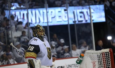 Vegas Golden Knights goaltender Marc-Andre Fleury takes a breather during a break in Game 1 of their Western Conference final series against the Winnipeg Jets in Winnipeg on Sat., May 12, 2018. Kevin King/Winnipeg Sun/Postmedia Network
