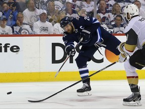 Winnipeg Jets forward Blake Wheeler fires a shot at Vegas Golden Knights goaltender Marc-Andre Fleury as Brayden McNabb defends during Game 1 of their Western Conference final series in Winnipeg on Sat., May 12, 2018. Kevin King/Winnipeg Sun/Postmedia Network