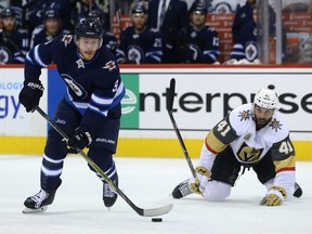Winnipeg Jets forward Andrew Copp (left) leaves Vegas Golden Knights forward Pierre-Edouard Bellemare behind during Game 1 of their Western Conference final series in Winnipeg on Sat., May 12, 2018.