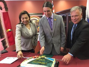 Left to right) Manitoba Keewatinowi Okimakanak (MKO) Grand Chief Sheila North, Winnipeg Centre MP Robert-Falcon Ouellette, and Manitoba Public Insurance vice-president Ward Keith cut a cake at a press conference to celebrate the successful first steps of the Class 5 Community Ambassador Program (5CAP) at a press conference at the MKO offices in Winnipeg on Monday.