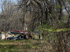 A strip of police tape remains at the scene Sunday where police said a volunteer dive team pulled a body from the Red River, near the North Perimeter Park boat launch, on Sat., May 12, 2018. Kevin King/Winnipeg Sun/Postmedia Network