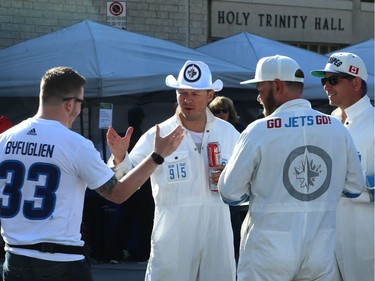 Friends connect at the Whiteout Street Party before the Winnipeg Jets met the Vegas Golden Knights in Game 2 of the Western Conference final in Winnipeg on Mon., May 14, 2018. Kevin King/Winnipeg Sun/Postmedia Network