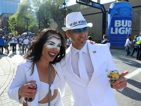 Erin Lubinski and Marc Chateau embrace at the Whiteout Street Party before the Winnipeg Jets met the Vegas Golden Knights in Game 2 of the Western Conference final in Winnipeg on Mon., May 14, 2018. Kevin King/Winnipeg Sun/Postmedia Network