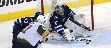 Winnipeg Jets goaltender Connor Hellebucyk makes a save against the Vegas Golden Knights during Game 2 of the Western Conference final in Winnipeg on Mon., May 14, 2018. Kevin King/Winnipeg Sun/Postmedia Network