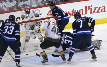 Vegas Golden Knights forward Tomas Tatar celebrates his goal from behind the net of Winnipeg Jets goaltender Connor Hellebuyck during Game 2 of the Western Conference final in Winnipeg on Mon., May 14, 2018. Kevin King/Winnipeg Sun/Postmedia Network