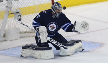 A Vegas Golden Knights shot gets past Winnipeg Jets goaltender Connor Hellebuyck before hitting the post during Game 2 of the Western Conference final in Winnipeg on Mon., May 14, 2018. Kevin King/Winnipeg Sun/Postmedia Network