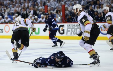 Vegas Golden Knights defenceman Brayden McNabb (right) is penalized for tripping Winnipeg Jets forward Blake Wheeler during Game 2 of the Western Conference final in Winnipeg on Mon., May 14, 2018. Kevin King/Winnipeg Sun/Postmedia Network