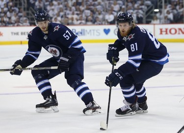 Winnipeg Jets forward Kyle Connor and defenceman Tyler Myers in close quarters against the Vegas Golden Knights during Game 2 of the Western Conference final in Winnipeg on Mon., May 14, 2018. Kevin King/Winnipeg Sun/Postmedia Network