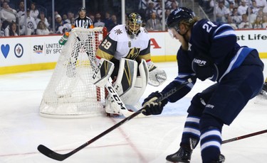 Vegas Golden Knights goaltender Marc-Andre Fleury keeps an eye on Winnipeg Jets forward Patrik Laine during Game 2 of the Western Conference final in Winnipeg on Mon., May 14, 2018. Kevin King/Winnipeg Sun/Postmedia Network