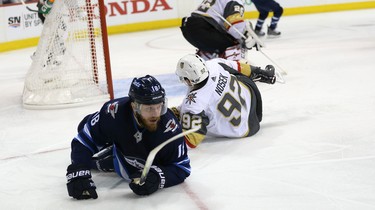 Winnipeg Jets centre Bryan Little is spilled by Vegas Golden Knights forward Tomas Nosek during Game 2 of the Western Conference final in Winnipeg on Mon., May 14, 2018. Kevin King/Winnipeg Sun/Postmedia Network