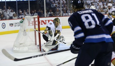 A shot from Winnipeg Jets forward Kyle Connor squeaks through Vegas Golden Knights goaltender Marc-Andre Fleury during Game 2 of the Western Conference final in Winnipeg on Mon., May 14, 2018. Kevin King/Winnipeg Sun/Postmedia Network