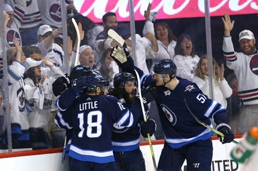 Bryan Little, Kyle Connor, Mathieu Perreault and Tyler Myers of the Winnipeg Jets celebrates a goal from Conner against the Vegas Golden Knights during Game 2 of the Western Conference final in Winnipeg on Mon., May 14, 2018. Kevin King/Winnipeg Sun/Postmedia Network
