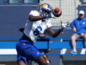 Receiver Corey Washington catches a pass during the opening day of Winnipeg Blue Bombers rookie camp at Investors Group Field in Winnipeg on Wed., May 16, 2018. Kevin King/Winnipeg Sun/Postmedia Network