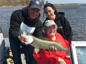 Former Winnipeg Jets star Bobby Hull (centre) with his 29.5 inch fish and Laurent Raymond and his daughter Drew. Hull was in Winnipeg for the 1978 WHA Jets reunion and decided to take in some fishing at Pine Falls.