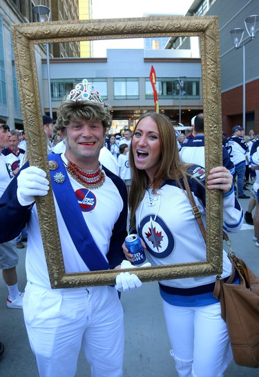 Erika Csucak joins Cam Scott in the frame at the Whiteout Street Party before the Winnipeg Jets battled the Vegas Golden Knights during Game 5 of the Western Conference final in Winnipeg on Sun., May 20, 2018. Kevin King/Winnipeg Sun/Postmedia Network