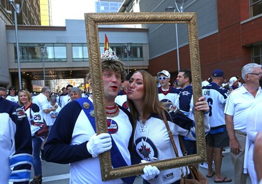 Erika Csucak joins Cam Scott in the frame at the Whiteout Street Party before the Winnipeg Jets battled the Vegas Golden Knights during Game 5 of the Western Conference final in Winnipeg on Sun., May 20, 2018. Kevin King/Winnipeg Sun/Postmedia Network