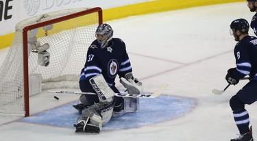 Winnipeg Jets goaltender Connor Hellebuyck is beat on a shot from Vegas Golden Knights forward Alex Tuch during Game 5 of the Western Conference final in Winnipeg on Sun., May 20, 2018. Kevin King/Winnipeg Sun/Postmedia Network