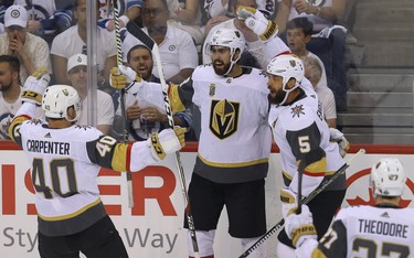 Vegas Golden Knights forward Alex Tuch (centre) celebrates his goal against the Winnipeg Jets during Game 5 of the Western Conference final in Winnipeg with Ryan Carpenter (left) and Deryk Engelland on Sun., May 20, 2018. Kevin King/Winnipeg Sun/Postmedia Network
