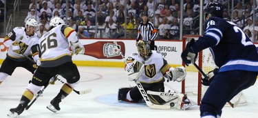 Vegas Golden Knights goaltender Marc-Andre Fleury pushes a puck away after a Winnipeg Jets shot during Game 5 of the Western Conference final in Winnipeg on Sun., May 20, 2018. Kevin King/Winnipeg Sun/Postmedia Network