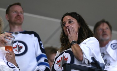 A Winnipeg Jets fan holds back tears after the team fell to the Vegas Golden Knights in the Western Conference final in Winnipeg on Sun., May 20, 2018. Kevin King/Winnipeg Sun/Postmedia Network