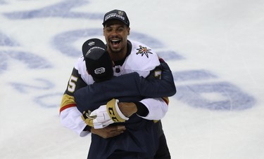Vegas Golden Knights forward Ryan Reaves, from Winnipeg, hugs a team member after knocking off the Winnipeg Jets in the Western Conference final in Winnipeg on Sun., May 20, 2018. Kevin King/Winnipeg Sun/Postmedia Network