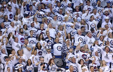 Fans celebrate after a goal from Winnipeg Jets defenceman Josh Morrissey against the Vegas Golden Knights during Game 5 of the Western Conference final in Winnipeg on Sun., May 20, 2018. Kevin King/Winnipeg Sun/Postmedia Network