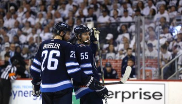 Winnipeg Jets captain Blake Wheeler (left) and centre Mark Scheifele hatch a plan against the Vegas Golden Knights during Game 5 of the Western Conference final in Winnipeg on Sun., May 20, 2018. Kevin King/Winnipeg Sun/Postmedia Network