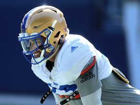 Running back Andrew Harris smiles during Winnipeg Blue Bombers training camp at Investors Group Field on Mon., May 21, 2018. Kevin King/Winnipeg Sun/Postmedia Network